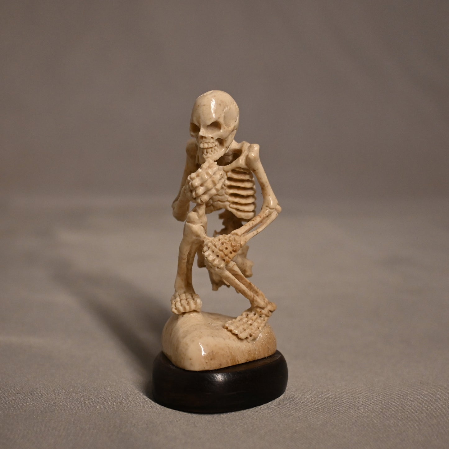 Bone Carved Thinking Skeleton