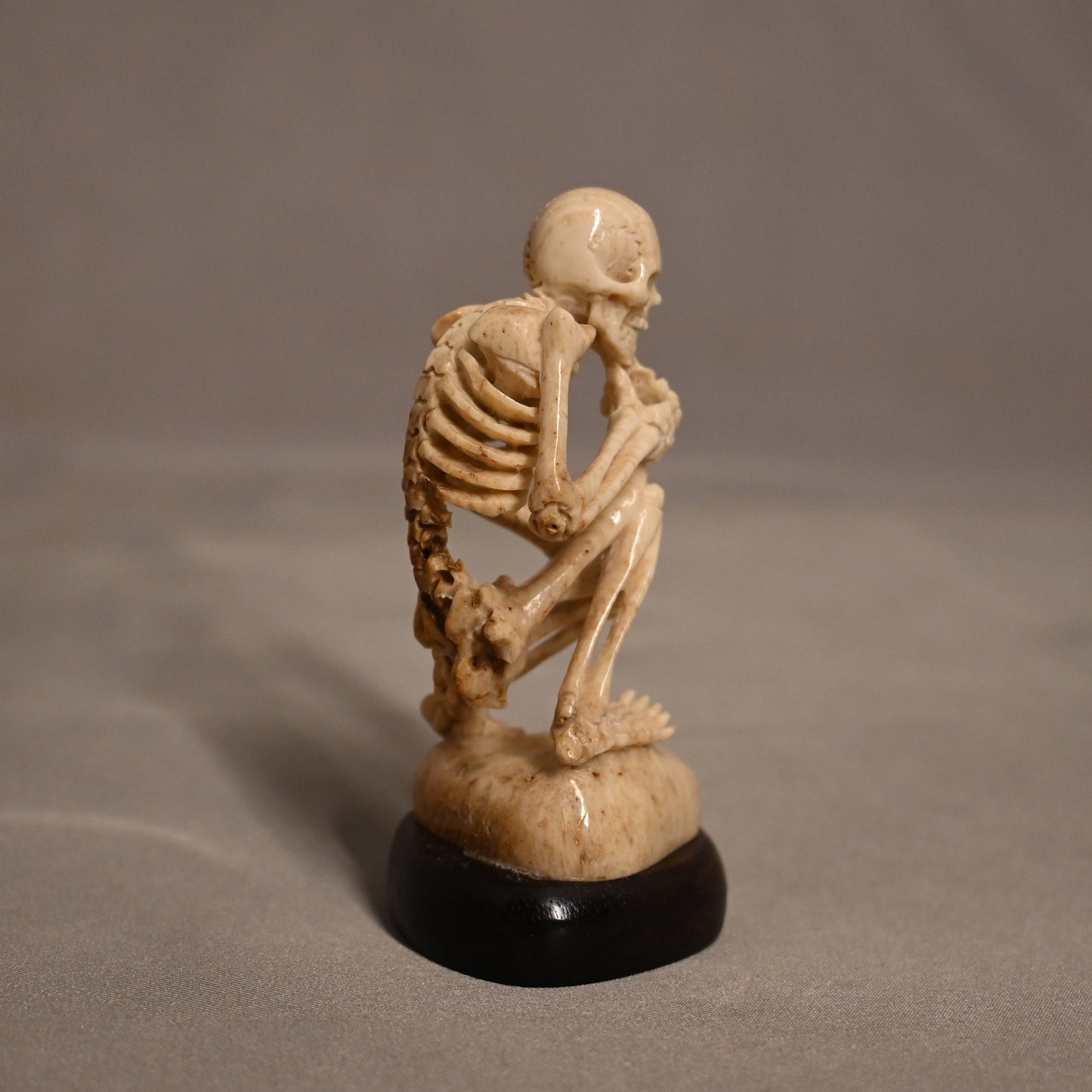 Bone Carved Thinking Skeleton