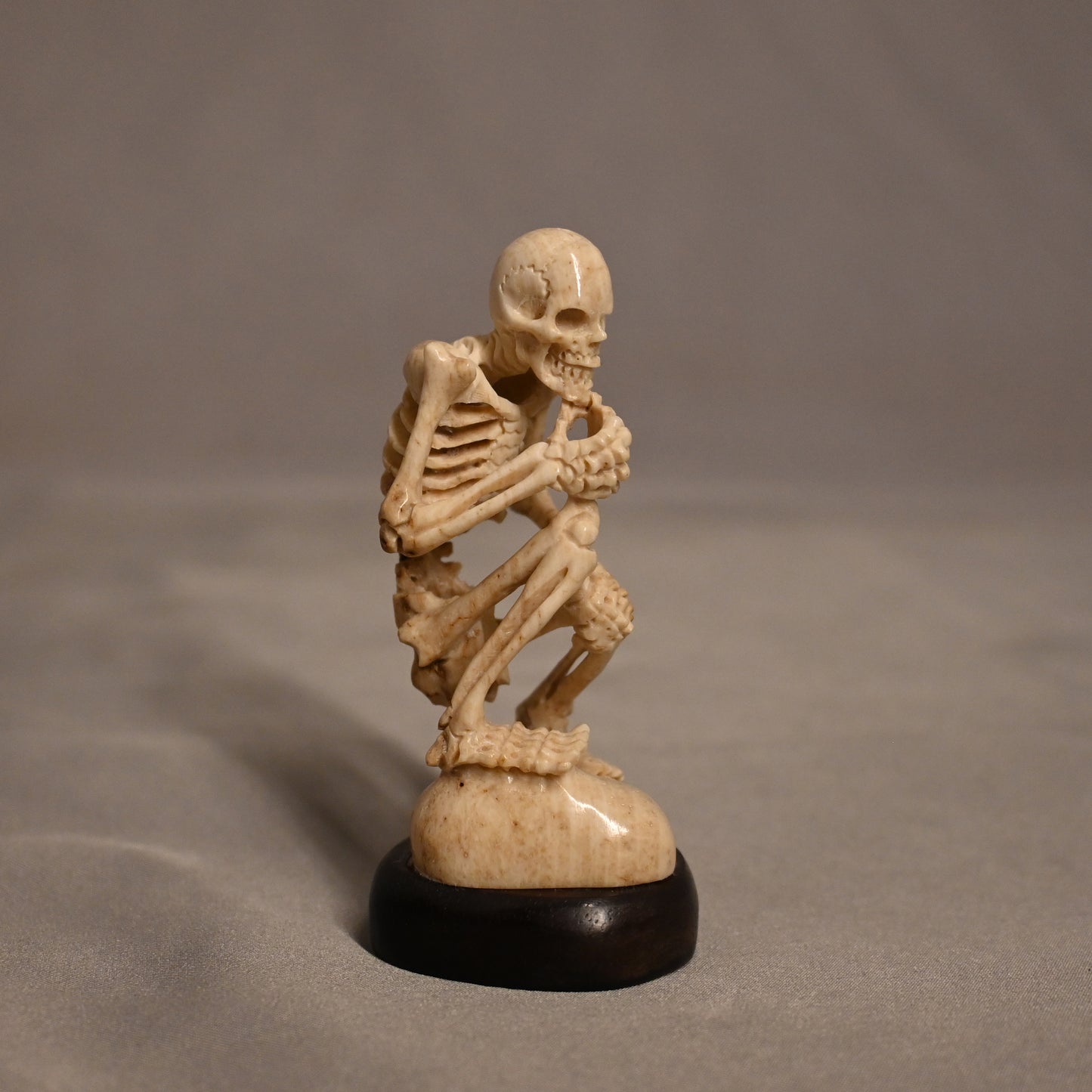 Bone Carved Thinking Skeleton