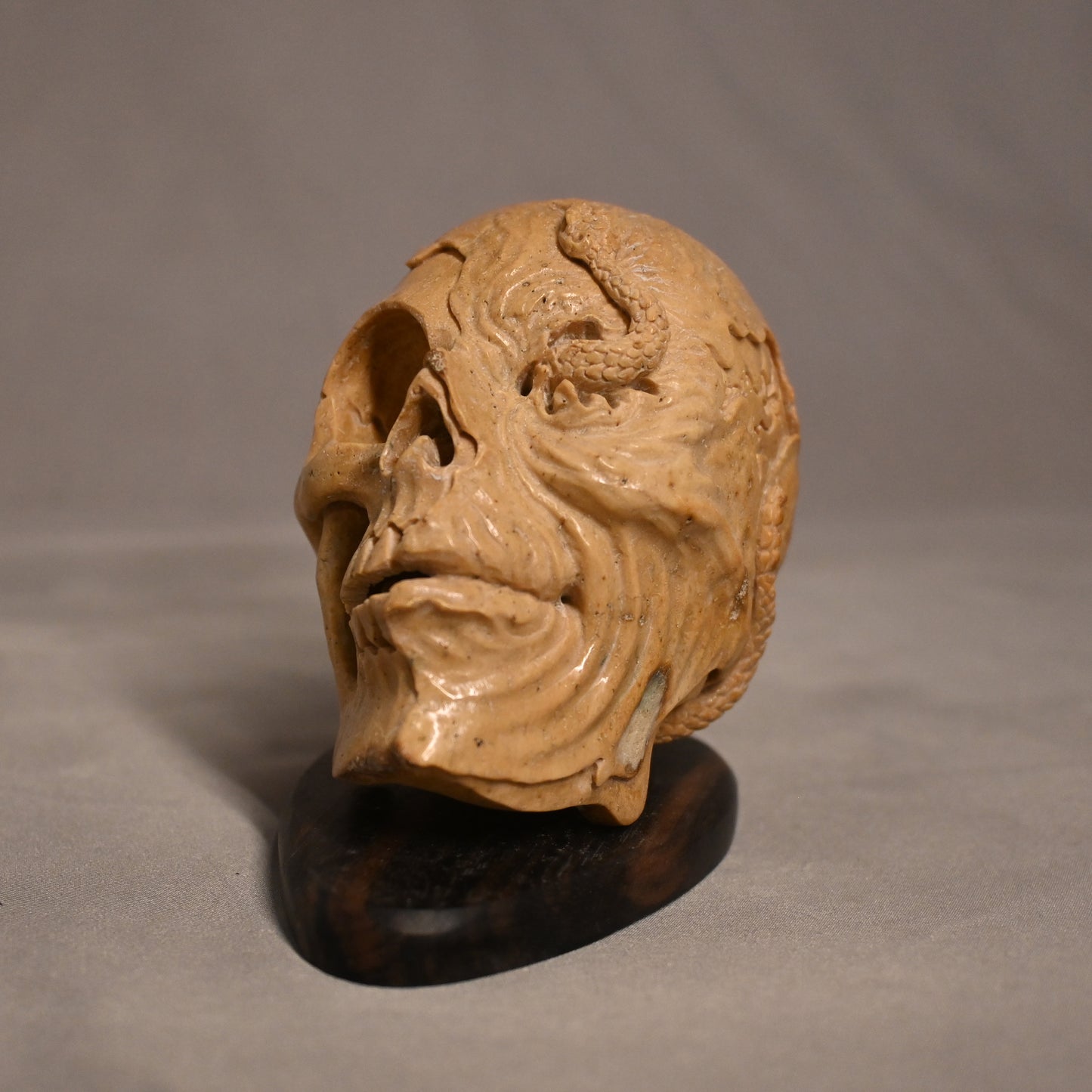 Bone Carved Skull with Snake