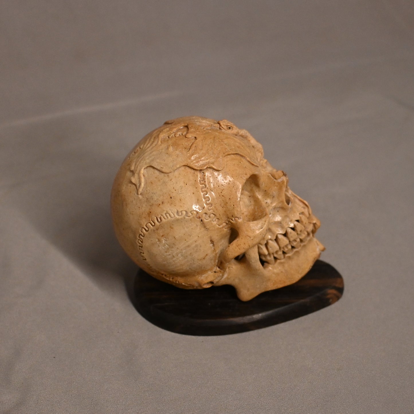 Bone Carved Skull with Snake