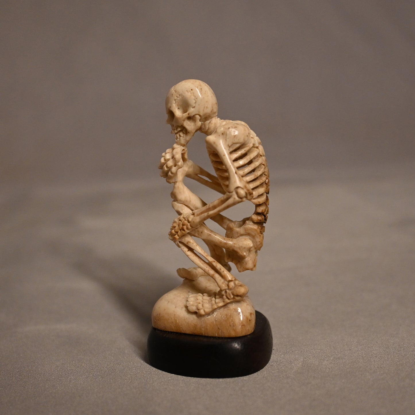 Bone Carved Thinking Skeleton