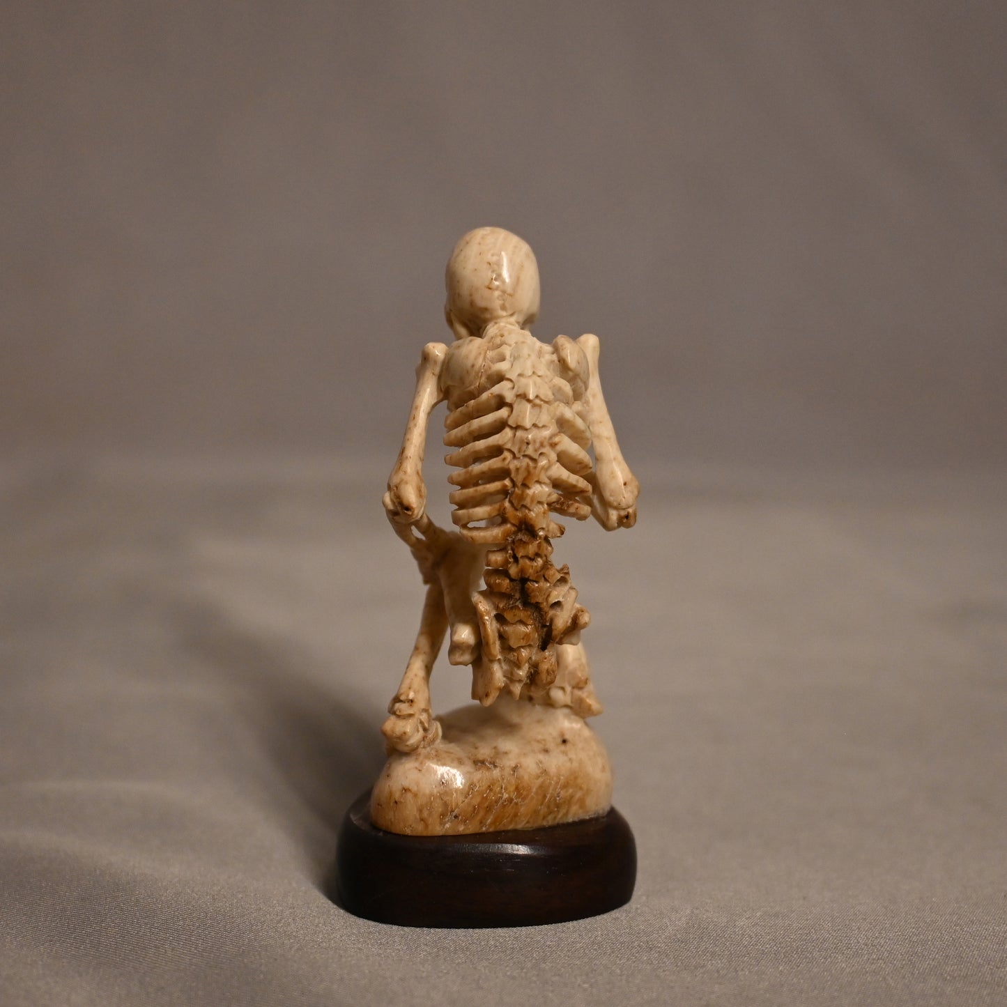 Bone Carved Thinking Skeleton